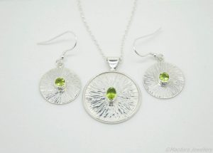 Peridot sun disc earrings and necklace by Macdara Ó Graham